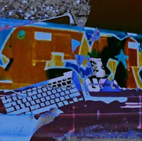 a computer keyboard with graffiti on it